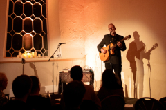 Craig Fortnam performing as Arch Garrison at Buds & Spawn in the Samuel Worth Chapel on 2nd Oct 2025 - photo (c) Aitch Nicol